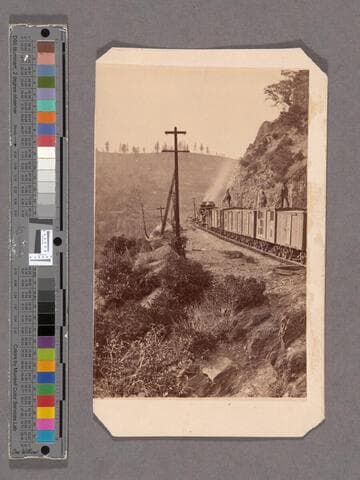Central Pacific Railroad train along the route in the mountains heading West at Cape Horn