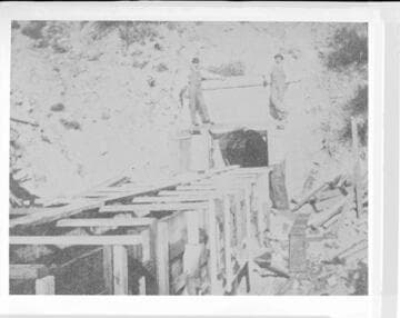 Two members of the construction crew standing on the tunnel by the flume of Santa Ana River #1 Hydro Plant