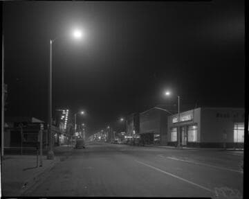 Street lighting at night in a business district near Mission Ave