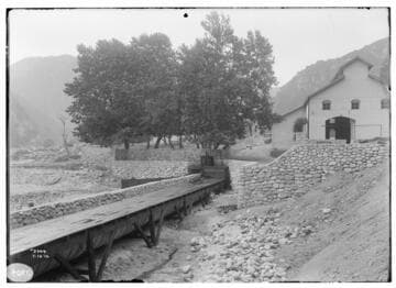 Reconstruction at SAR #2. View of Powerhouse from downstream, across canyon, showing flume carrying tail