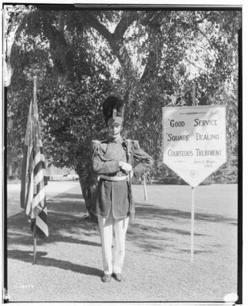 Drum major of Edison Band with banner