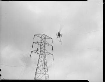 Use of helicopter in stringing conductors for newly constructed transmission line