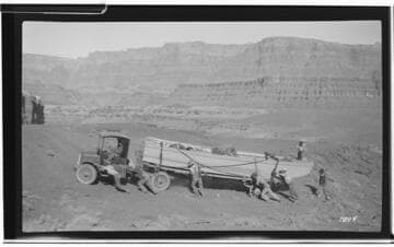 Colorado River - Flatbed truck hauling river expedition boat away from river