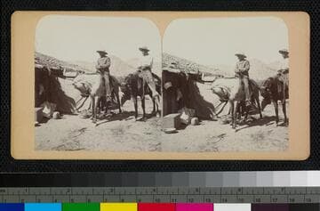 Hualapai Indians on horses next to a Hualapai house