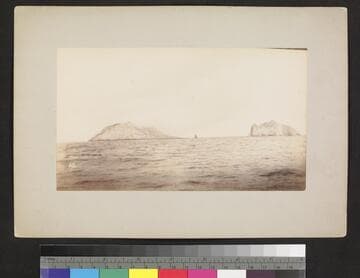 View of new and old Bogosloff Islands. New island and active volcano arose from the sea in the fall of 1883. "Corwin" first vessel to land and examine it