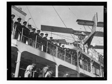 Airplane on French naval ship with sailors and officers