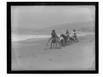 Scouts playing leap frog on the beach at Santa Monica Girl Scout camp