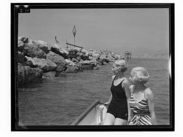Two women in close view of breakwater at the Yacht Harbor Breakwater dedication, Santa Monica