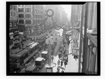 View down Broadway, downtown Los Angeles, with streetcars and Christmas decorations