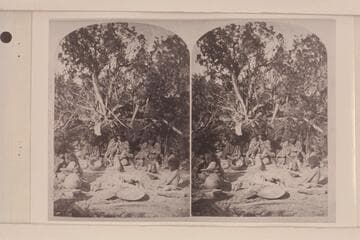 [print from a stereo] At Home.  Note the lack of fringed buckskin