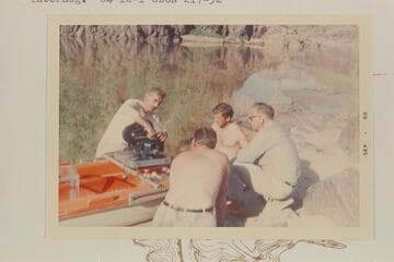 Jake rigs a camera on a Sportyak for run of 217 Mile Rapid. Bill Lindsley and Bill Wynn supervise