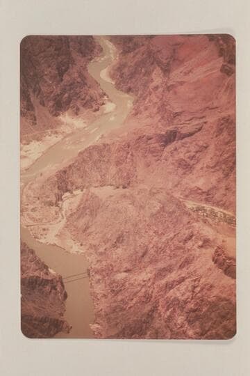 Down river in Grand Canyon from Mile 87-89 showing the suspension bridge and the mouth of Bright Angel Creek
