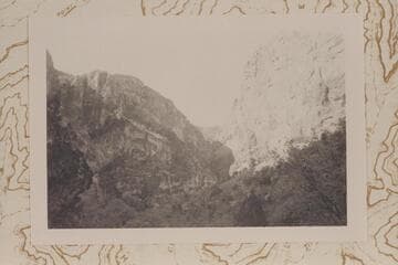 South to Ra-Osiris Saddle showing sheer drop at top of Redwall at head of gorge. The Redwall climbing route follows vegetation left of center in photo and this is probably Stanton-Hislop-Kane descent route
