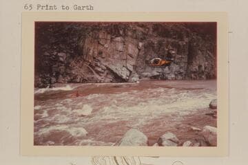 Motion picture camera in chopper follows Garth Marston; 217 Mile Rapid. Wilding camera crew. Sportyak