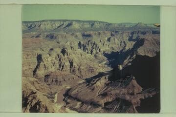 Upriver from approximately Mile 207. The greenery on the right bank at right center is Spring Canyon