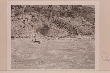Rod Sanderson piloting the "Twin" through Badger Creek Rapid.  Danny Daniels is riding forward