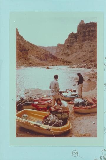 Loading the Yaks at camp at Mile 202.25, right bank. Rapid No. 23 is below--The Buzzter. Jorgen Visbak in foreground. Buzz Belknap and Dock Marston