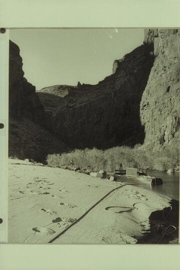 Dock Marston fishing from the upper end of the beach at Tapeats Creek. The Chris-Craft is moored in the lagoon