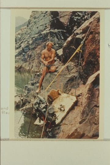 A lift on the engine during salvage of inboard-outboard (Homer Morgan).  Head of Gneiss Canyon Rapid