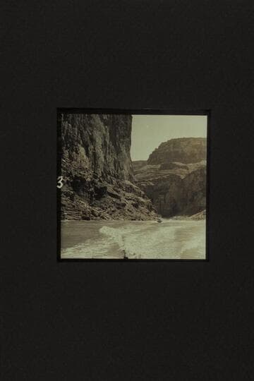 Cruising between President Harding Rapid and Nancoweap, Marble Canyon. The boat is the "Rattlesnake" with Rod Sanderson piloting and Joe Desloge and Hugh Cutler riding as passengers