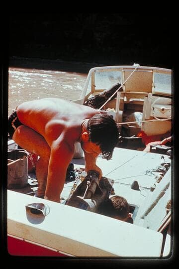 Dick Young repairs "Big Red," Mile 164