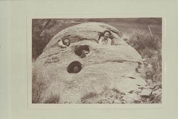 Pumpkin Rock. Harry Aleson and Dr. F. M. Smith in the rock