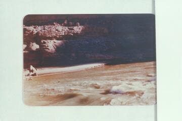Dave following streamer entrant to 187 1/2 Mile Rapid, Cataract Canyon. In making the pring, the boat was cut off the left side