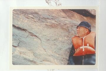 Dock Marston posed at the 1836 D. Julien inscription at Mile 185.75 Cataract Canyon