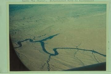 From Knowles Canyon about mile 120 (134.5) to Smith Fork and Forgotten Canyon; Hansen Creek and Crystal Springs Canyon; North Gulch and Moqui Canyon; Bullfrog and Hall Creek at right bank; The Chapel.  Waterpocket Fold in background