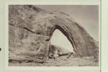 Gothic Arch; width 174 feet, estimated height 190 feet. End of buttress of Navajo sandstone resting on Kayenta. Soda Creek branch of Escalante River