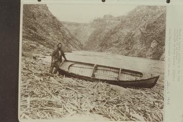 Charles Russell sitting on the "Utah."  Note the bulkheads and the seat
