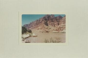 Boats moored at left bank above and opposite Range Canyon. Mile 205.3