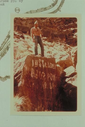 Bill Belknap standing above the "1st Steamer MAJOR POWELL Mar. 24 1893" inscription at Mile 212.9, right bank