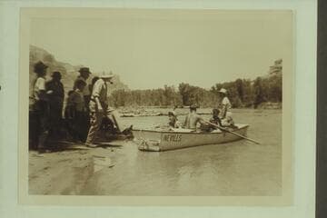 Landing for lunch between Gateway and the Narrows, Dolores River. In the boat are Becky and Pres Walker, Margaret and Dock Marston