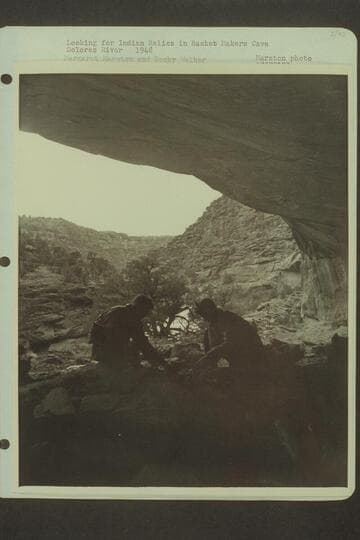 Looking for Indian relics in Basket Makers Cave, Dolores River.  Margaret Marston and Becky Walker