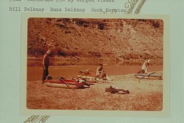 Stowing gear for the going through Cataract Canyon in Sportyaks. Camp below the mouth of Butler Canyon. Mile 212.8. Bill Belknap, Buzz Belknap, Dock Marston
