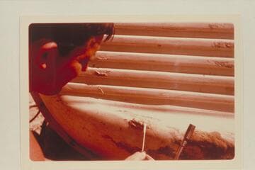 Buzz Belknap repairs his Sportyak.  Camp at Mile 209.6 between Rapids #6 and #7