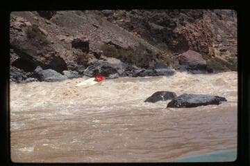 "Wee Red" climbs Vulcan Rapids