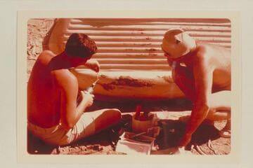 Bill Belknap watches Buzz repair the Sportyak. Camp at Mile 209.6. Right bank between Rapids #6 and #7