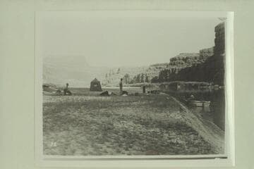 Camp between Moab [and] The Junction.  Tandem motor boats and the 10-ft. fold-flat which is on the beach