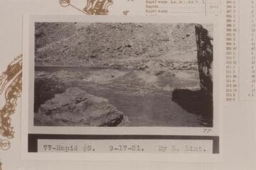 Ellsworth Kolb running U. S. Geological Survey skiff in Rapid #5