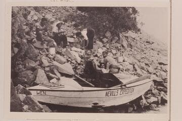 The battered "Wen" pulled up on the talus near the foot of Rapid 23, left bank. Upper: Don Harris, Norm Nevills, Lois Jotter. Lower: Bill Gibson, Gene Atkinson