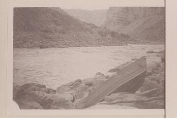 Buzz Holmstrom's portage in Cataract Canyon at rapid which he numbered 16. Between Miles 202 and 203. Rapid No. 23 in the Chenweth-Hoyt table. Heads at Mile 202.30 and drops 9 ft. in .15 miles