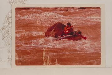Dock Marston riding a Sportyak in the lower end of One Mile Rapid