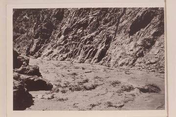 Emery Kolb in the boat "Marble" running the Sockdologer Rapid. From LaRue Grand Canyon Vol. I in Huntington Library