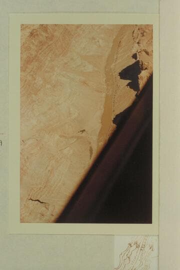 Up river from Mile 198.2. The river appears at top at Mile 199.6 and is hidden by the edge of the plane at Mile 198.7. The Rapid is #28