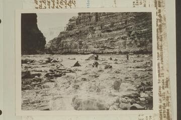 The Eddy crew lining Dark Canyon Rapid. Eddy photo No. G. C. 37. Copied from Carey collection