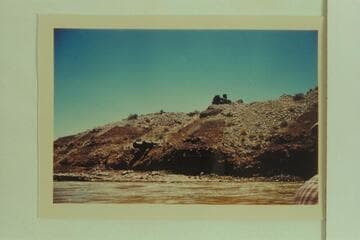 Old boiler at top of gravel bar and discharge pipes below  Zahns Camp.  San Juan River