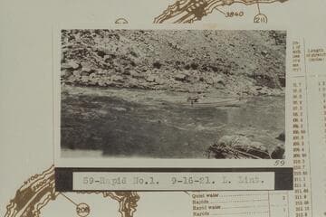 Ellsworth Kolb in USGS skiff in the Brown Betty Rapid, No. 1.  The Brown Betty Rapid heads at Mile 212.3 and drops 4 ft. in .15 miles