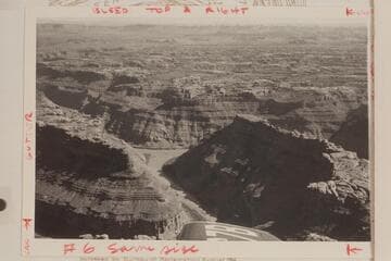 Down Stillwater Canyon to the mouth of the Green River. The Colorado, formerly Grand River, enters from left and the combined rivers flow into Cataract Canyon at the right